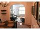Inviting dining room with a view of the staircase and living room featuring modern decor and ample lighting at 13934 Kings Carriage Ln, Charlotte, NC 28278