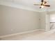 This room has a ceiling fan and neutral carpet, and has access to the upstairs hallway at 14222 Richmond Park Ave, Charlotte, NC 28277
