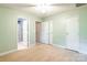 This bedroom provides three white doors, carpet, and neutral colored walls at 14222 Richmond Park Ave, Charlotte, NC 28277