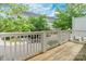 Wooden deck offering a beautiful view of the neighborhood and lush trees at 14222 Richmond Park Ave, Charlotte, NC 28277
