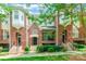 Beautiful brick townhome with covered porch and lush landscaping in a desirable neighborhood at 14222 Richmond Park Ave, Charlotte, NC 28277