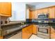 Modern kitchen with stainless steel appliances and granite countertops at 14222 Richmond Park Ave, Charlotte, NC 28277
