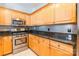 Well-equipped kitchen with granite counters and modern stainless steel appliances at 14222 Richmond Park Ave, Charlotte, NC 28277