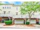 Charming townhome featuring a private garage, a small porch, and a well-manicured lawn at 14222 Richmond Park Ave, Charlotte, NC 28277
