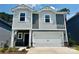 Two-story home featuring gray and white siding, a two-car garage, and a well-maintained front yard at 1426 31St Ne St, Conover, NC 28613