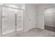Modern bathroom featuring a glass-enclosed shower and access to the walk-in closet at 1450 Mammoth Rd, Hickory, NC 28602
