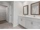 Bathroom with double vanity sinks, white cabinetry and modern fixtures at 1450 Mammoth Rd, Hickory, NC 28602