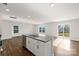Bright kitchen featuring granite countertops, an island with a sink, and stainless steel appliances at 1450 Mammoth Rd, Hickory, NC 28602