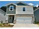 Charming two-story home featuring stone accents, a two-car garage, and a mix of traditional and modern design elements at 1458 31St Ne St, Conover, NC 28613
