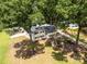 Aerial view of a charming home surrounded by lush greenery and mature trees at 1505 Clarendon Pl, Rock Hill, SC 29732