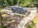 Expansive aerial view of the home with a well-manicured lawn and a long driveway at 1505 Clarendon Pl, Rock Hill, SC 29732