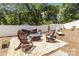 Backyard features a stylish fire pit with Adirondack chairs and a lounge chair at 1505 Clarendon Pl, Rock Hill, SC 29732