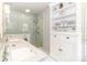 Elegant bathroom featuring double sinks, a glass-enclosed shower, white cabinetry, and a well-lit space at 1505 Clarendon Pl, Rock Hill, SC 29732