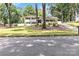 Charming two-story home with a well-manicured lawn, mature trees, and a classic front porch at 1505 Clarendon Pl, Rock Hill, SC 29732