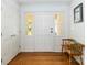 Bright foyer features hardwood floors, coat closet and a hall bench with a vintage phone at 1505 Clarendon Pl, Rock Hill, SC 29732
