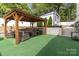 Outdoor gazebo with comfortable seating and views of the manicured backyard at 1505 Clarendon Pl, Rock Hill, SC 29732