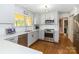 Well-lit kitchen with white countertops, modern appliances, and a view to the backyard at 1505 Clarendon Pl, Rock Hill, SC 29732