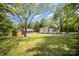 Expansive backyard featuring mature trees, outbuildings and an attractive lawn at 161 Ranson Rd, Lancaster, SC 29720