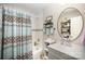 Clean bathroom with a shower-tub combo, decorative shower curtain, and a modern vanity at 161 Ranson Rd, Lancaster, SC 29720