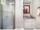 A bathroom featuring a glass door shower, framed mirror, and granite countertop at 161 Ranson Rd, Lancaster, SC 29720