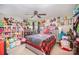 This bedroom features carpet, a ceiling fan, and an abundance of natural light at 161 Ranson Rd, Lancaster, SC 29720