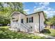The white brick house with a blue door has a well-maintained lawn with greenery at 161 Ranson Rd, Lancaster, SC 29720