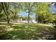 A lush front lawn complements this home, shaded by mature trees and manicured shrubbery at 161 Ranson Rd, Lancaster, SC 29720