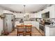 Well-lit kitchen with granite countertops, stainless steel appliances and white cabinetry at 161 Ranson Rd, Lancaster, SC 29720