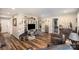 Cozy living room with hardwood floors and a TV, seamlessly transitions into the kitchen at 161 Ranson Rd, Lancaster, SC 29720