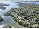Aerial view of a neighborhood with waterfront access, showcasing community amenities and lush landscaping at 19509 Trintella Ln, Cornelius, NC 28031
