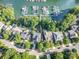 An aerial view of waterfront homes featuring private docks and lush green surroundings at 19509 Trintella Ln, Cornelius, NC 28031