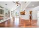 Bright living room with hardwood floors, vaulted ceiling, and natural light at 19509 Trintella Ln, Cornelius, NC 28031