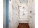 Shower features marble tiles, wooden floor and multiple shower heads at 19509 Trintella Ln, Cornelius, NC 28031