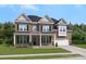 Beautiful two-story brick home with covered front porch and well-manicured lawn at 204 Coronado Ave, Matthews, NC 28104