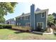 Expansive backyard with a wooden deck, lush lawn, and mature trees at 21514 Gulfstar Ct, Cornelius, NC 28031