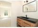 Bathroom featuring vanity and mirror with natural lighting at 21514 Gulfstar Ct, Cornelius, NC 28031