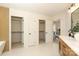 Bathroom featuring double vanity and walk-in closets at 21514 Gulfstar Ct, Cornelius, NC 28031