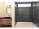 Bathroom features a shower and tub combination with blue tiled walls at 21514 Gulfstar Ct, Cornelius, NC 28031