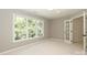 Bedroom with large windows and a glass panel door at 21514 Gulfstar Ct, Cornelius, NC 28031