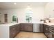Well-lit kitchen with stainless steel appliances, quartz countertop, and tiled backsplash at 21514 Gulfstar Ct, Cornelius, NC 28031