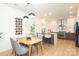 Modern kitchen and dining area with breakfast bar, stainless steel appliances, and stylish lighting at 21514 Gulfstar Ct, Cornelius, NC 28031