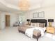 Bright primary bedroom featuring plush carpet, natural light, and a modern chandelier at 21514 Gulfstar Ct, Cornelius, NC 28031