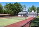 Two professionally maintained tennis courts with lush green landscaping in a quiet setting at 21514 Gulfstar Ct, Cornelius, NC 28031