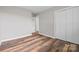 Neutral bedroom features wood-look flooring, double closets, and a hallway entrance at 2178 Tryon Courthouse Rd, Bessemer City, NC 28016
