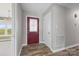 Welcoming entryway with decorative front door, stylish flooring, and natural light streaming through sidelight at 2178 Tryon Courthouse Rd, Bessemer City, NC 28016