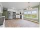 Spacious kitchen featuring stainless steel appliances, white cabinets, and a view of the outdoors at 2178 Tryon Courthouse Rd, Bessemer City, NC 28016