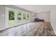 Inviting living room with hardwood floors, ample natural light, and French doors opening to the backyard at 2178 Tryon Courthouse Rd, Bessemer City, NC 28016