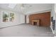 Spacious room features a brick wall, neutral carpet, and lots of natural light at 2178 Tryon Courthouse Rd, Bessemer City, NC 28016