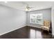 Bedroom featuring hardwood floors, a chair and large window at 2527 Fossil Stone Ln, Fort Mill, SC 29708