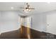A spacious bedroom featuring multiple closets, hardwood floors, and natural light at 2527 Fossil Stone Ln, Fort Mill, SC 29708